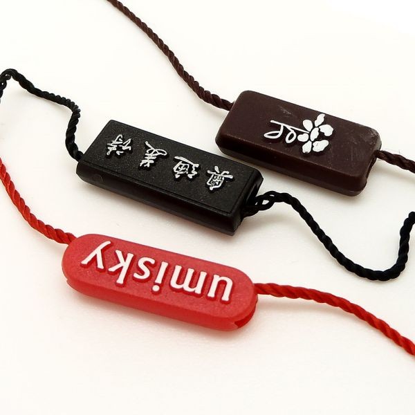 廠家直銷新款通用服裝吊粒吊繩 塑料商標(biāo)吊?？擅赓Mlogo設(shè)計